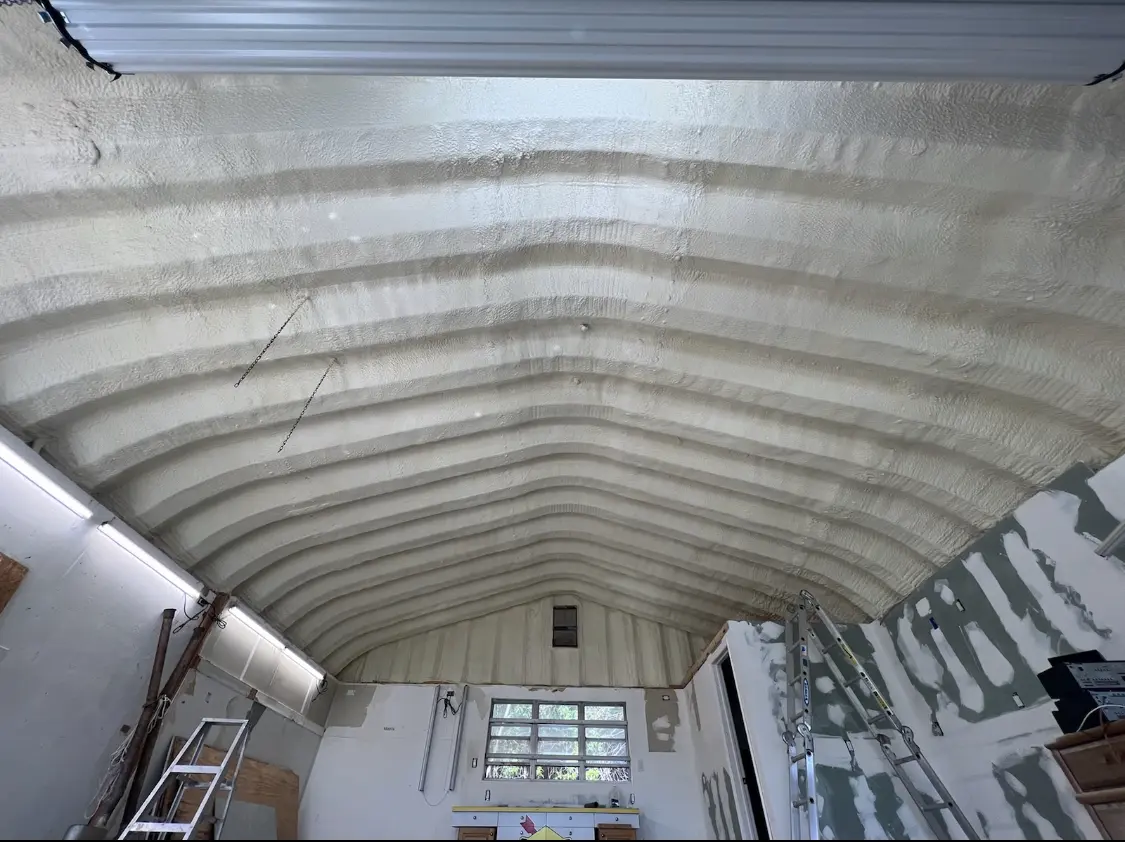 Spray polyurethane foam applied to the underside of a metal roof deck in Lake Ridge
